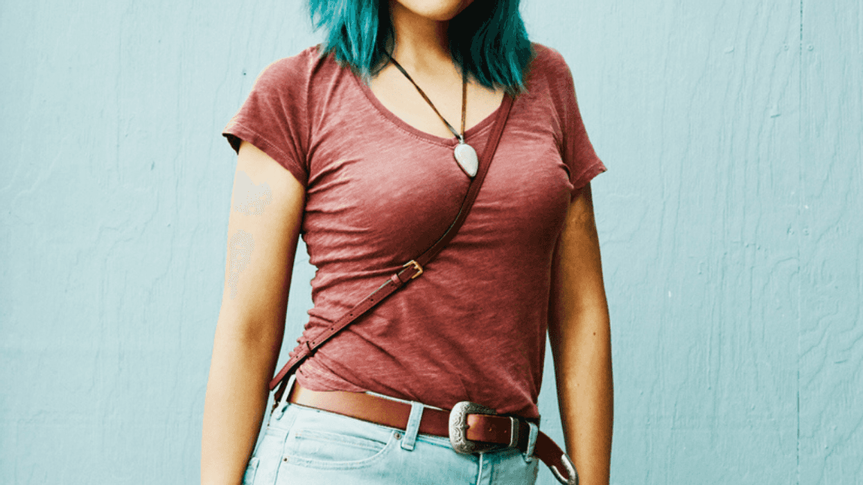 Young woman with locket necklace