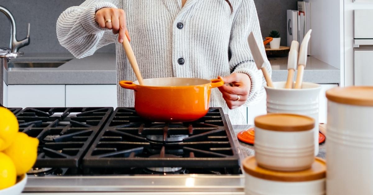 She is cooking dinner