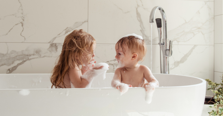 Young siblings taking bath together