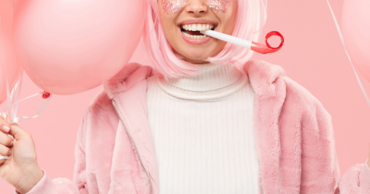 Woman enjoying party with pink decorations