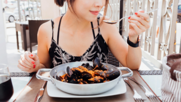 Woman enjoying seafood dish