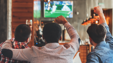 Men watching soccer game at a bar