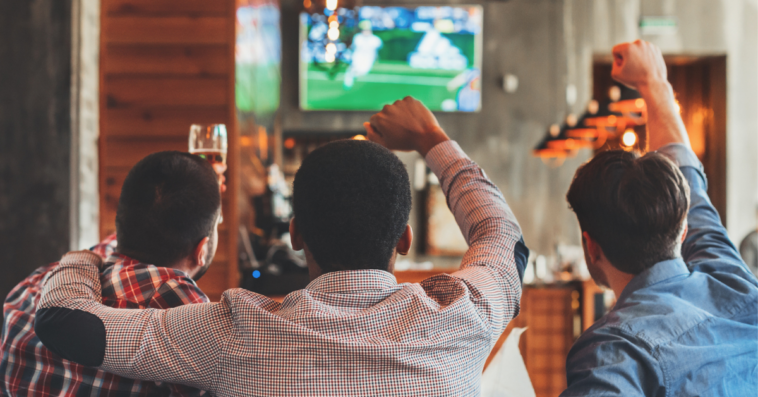 Men watching soccer game at a bar