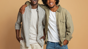 two young men smiling