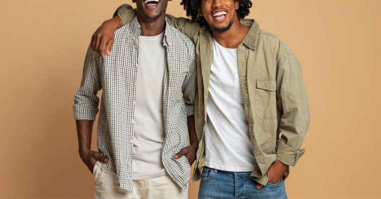 two young men smiling
