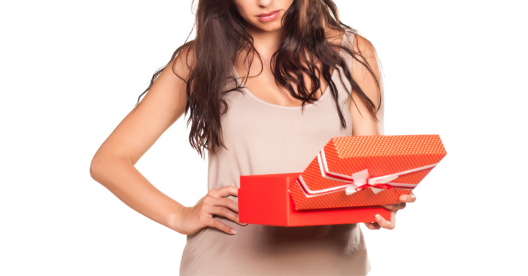 woman looking into gift box