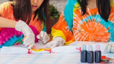 two young girls in tie dye shirts