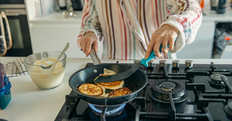 Woman making pancakes for breakfast