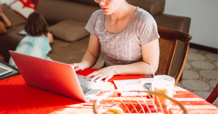 Young woman working from home with children