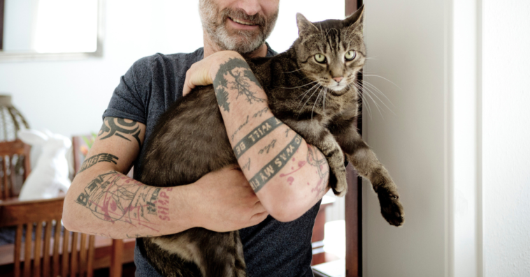 A man with his beloved house cat