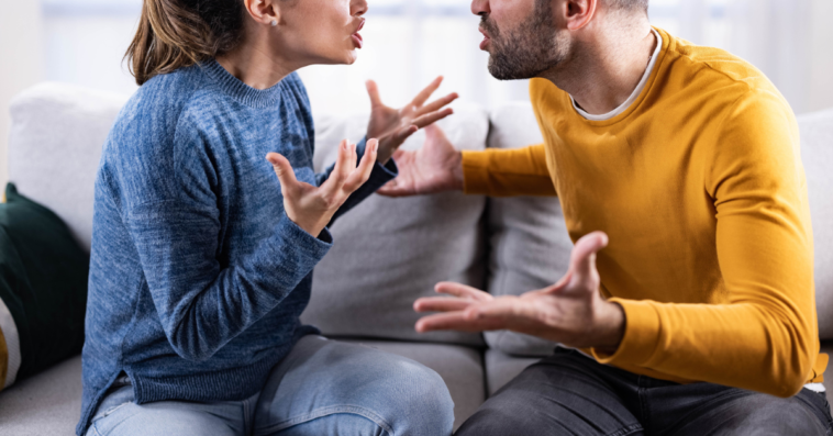 Man and woman fighting on couch