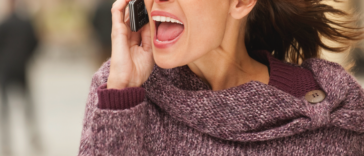 Woman yelling on cell phone.