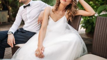 Annoyed bride and groom on a bench
