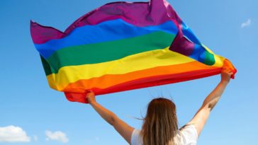 Woman holding pride flag