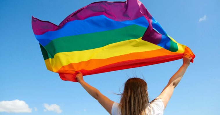 Woman holding pride flag