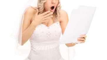 A shocked bride reads a message