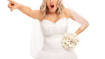 An outraged bride points a finger