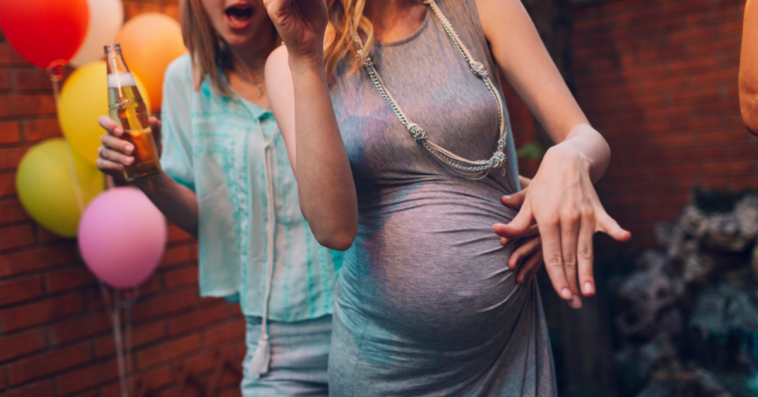 Pregnant woman at party