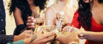 People at a party cheers with drinks