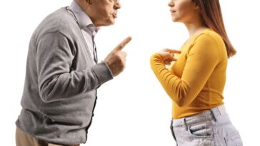 An older father and adult daughter argue