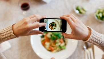 Woman photographing her food