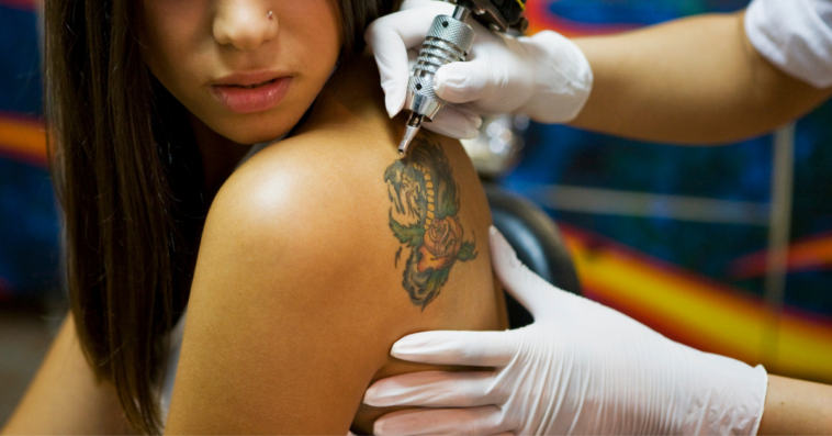 Woman getting a tattoo