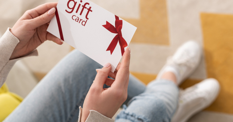 Woman holding a gift card