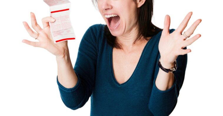 A woman is excited about her lottery ticket