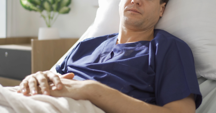 Man in hospital bed
