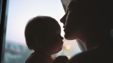 Silhouette of woman and baby.