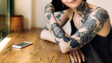 A woman with many tattoos