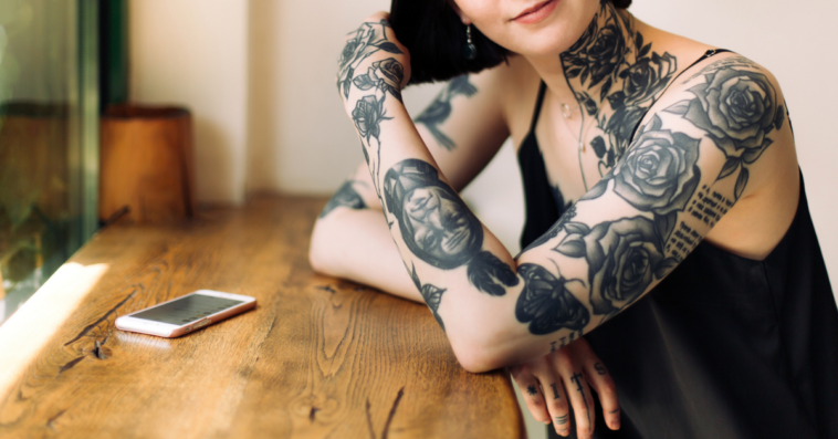A woman with many tattoos