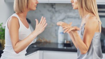 Two women argue in a kitchen