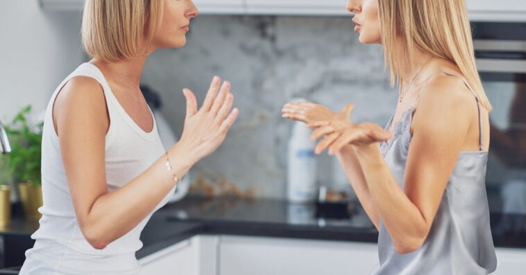 Two women argue in a kitchen