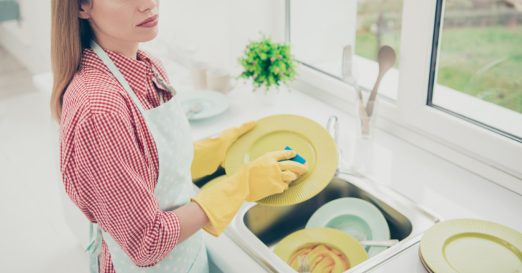 Angry woman washing dishes