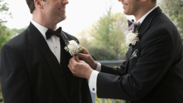 Two grooms enjoying each other's company