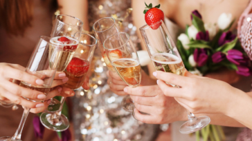 Bridesmaids and bride toasting at bachelorette party