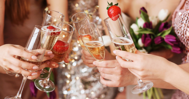 Bridesmaids and bride toasting at bachelorette party