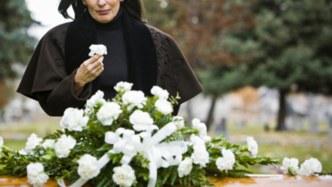 A woman grieving at grave