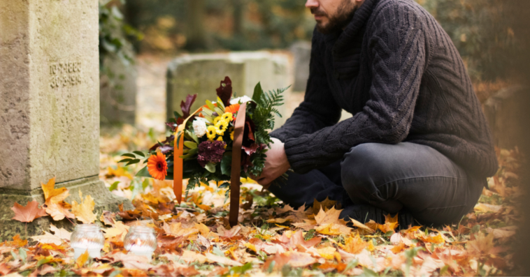 Grieving father at child's gravesite