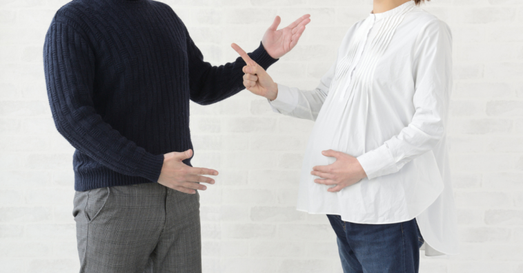 Pregnant woman and husband arguing