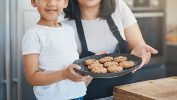 Young boy and woman with cookies
