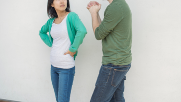 Frustrated woman looking at man pleading