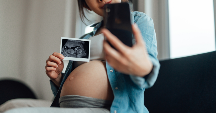 Pregnant Lady with a photo