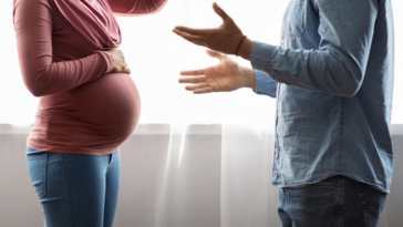 Man and pregnant woman having argument