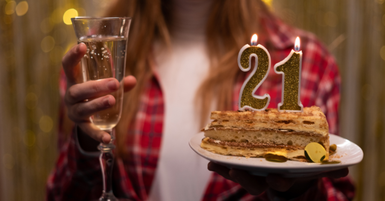 Woman with 21st birthday cake.