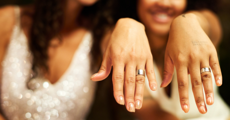 Two women with wedding rings