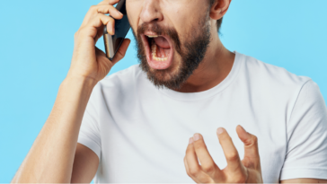 Man yelling into phone