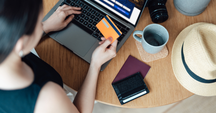 woman making travel arrangements on a laptop