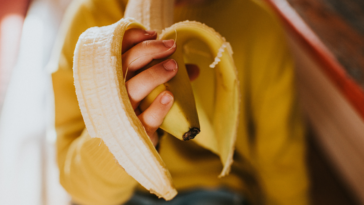 Girl eating a banana